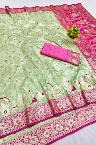 Light green zari woven banarasi silk blend saree with blouse piece