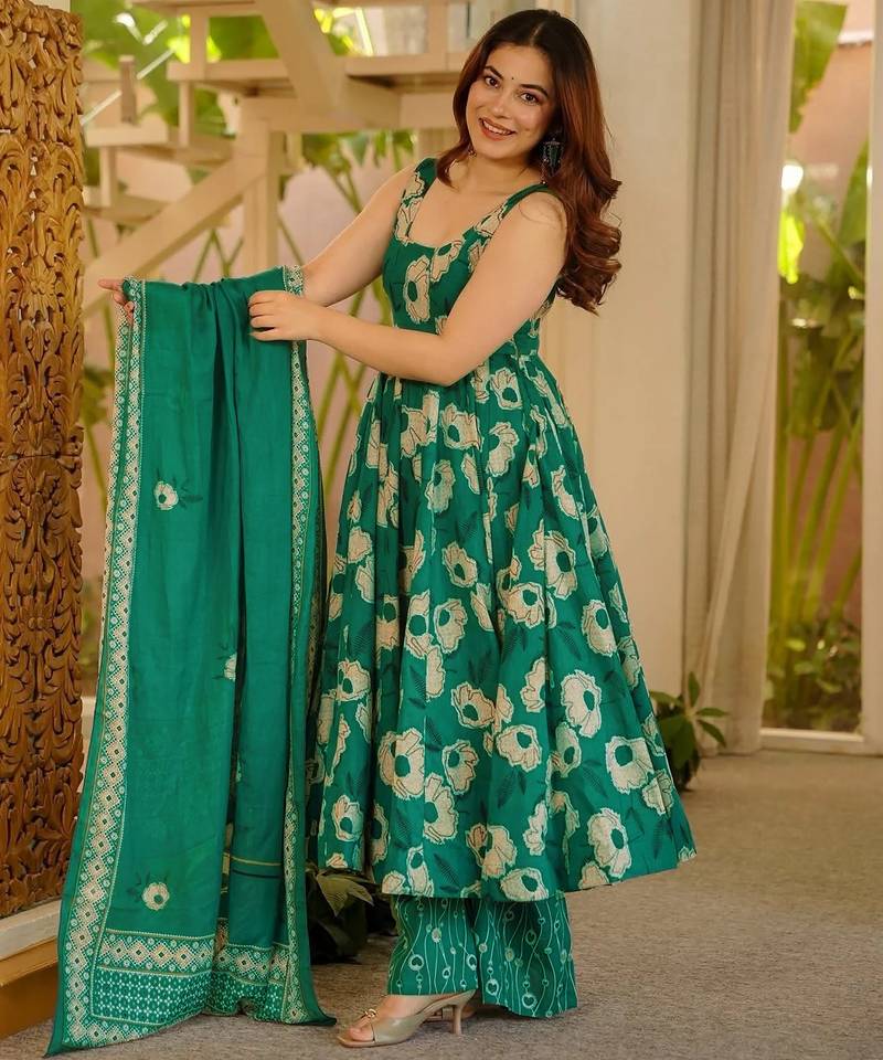 Green color muslin printed ceremonial readymade attire