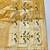 Gold zari woven paithani silk blend saree with blouse piece