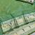 Parrot green zari woven paithani silk blend saree with blouse piece