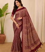 red ajarakh print with mirror and beautiful tussle crepe silk saree