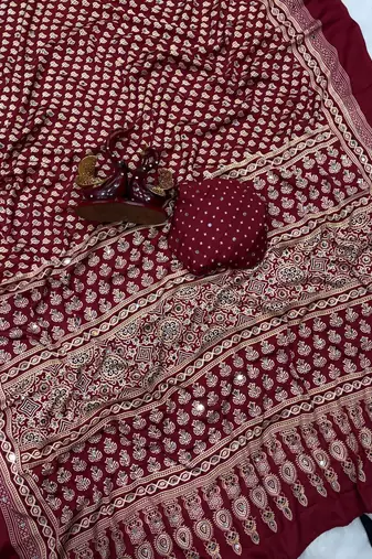 red ajarakh print with mirror and beautiful tussle crepe silk saree