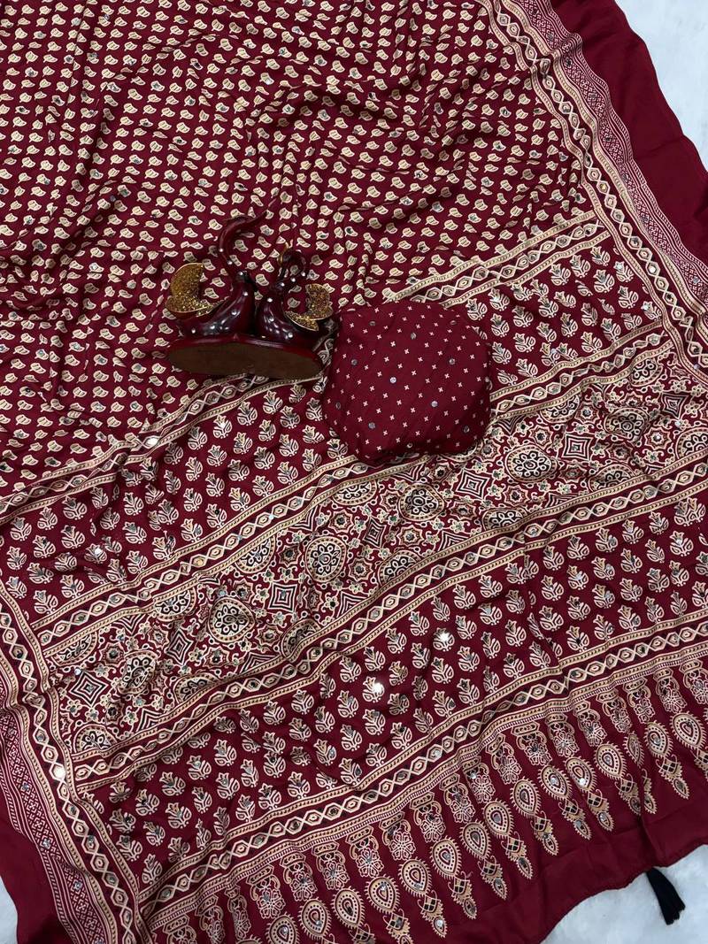 red ajarakh print with mirror and beautiful tussle crepe silk saree