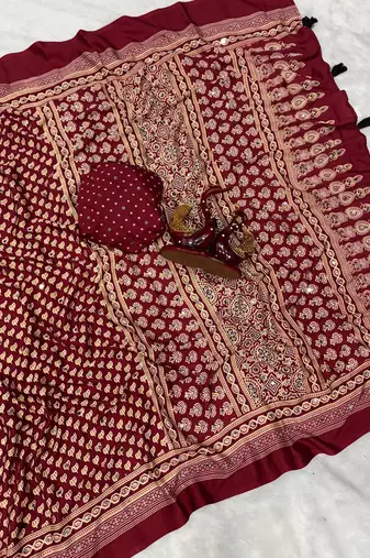red ajarakh print with mirror and beautiful tussle crepe silk saree
