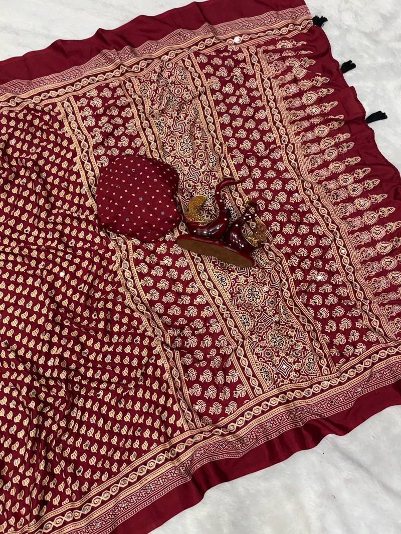 red ajarakh print with mirror and beautiful tussle crepe silk saree