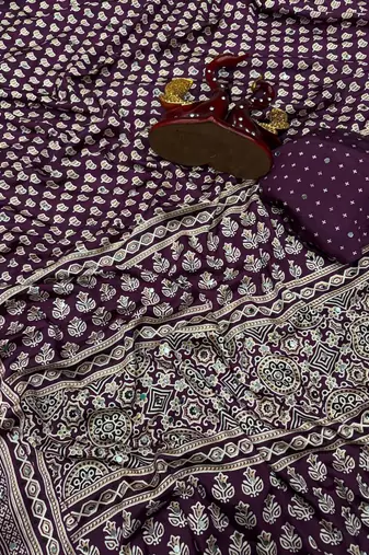 plum ajarakh print with mirror and beautiful tussle crepe silk saree