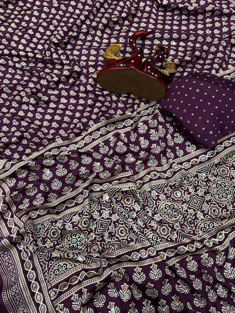 plum ajarakh print with mirror and beautiful tussle crepe silk saree