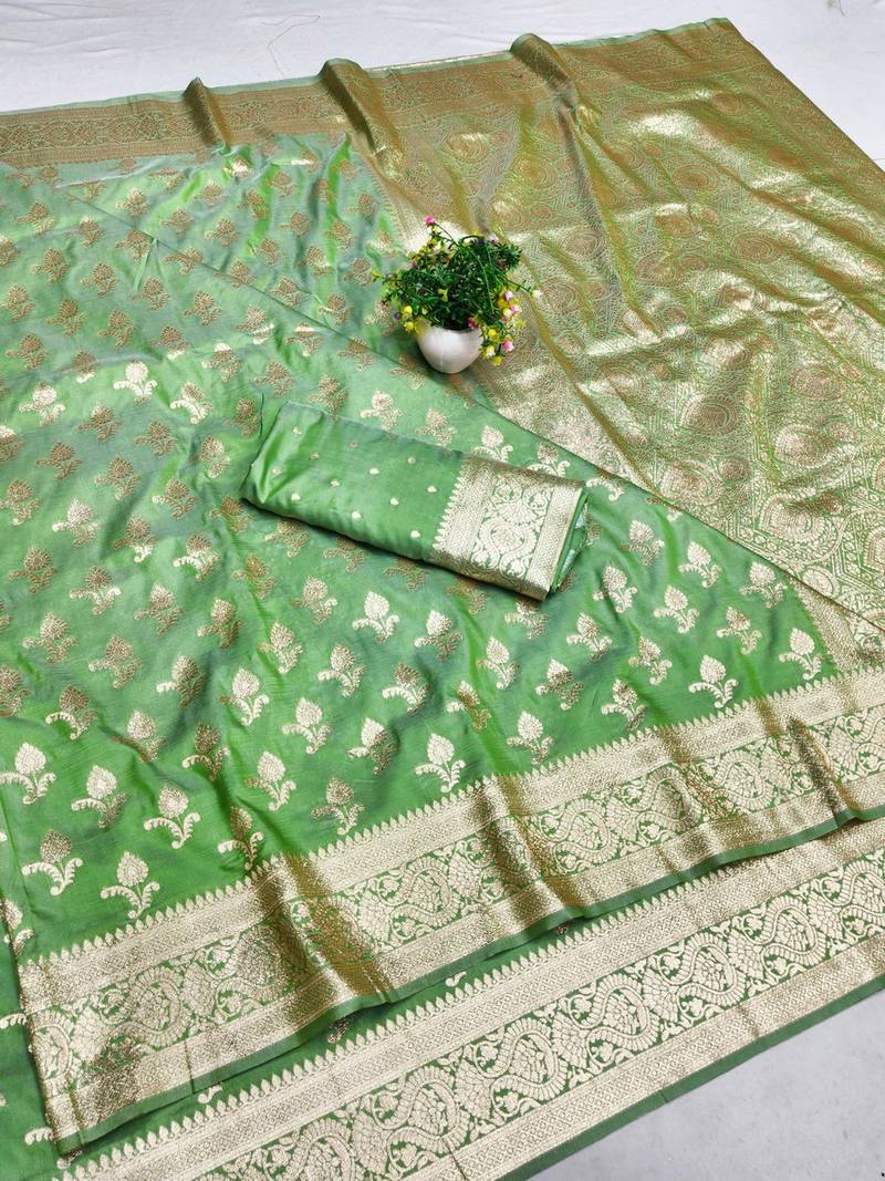 Green zari woven banarasi silk blend saree with blouse piece
