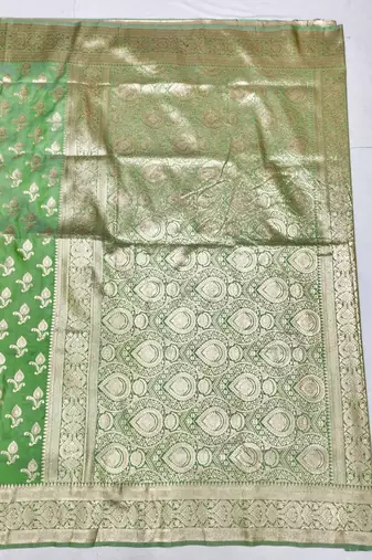 Green zari woven silk blend saree with blouse piece