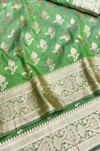 Green zari woven silk blend saree with blouse piece