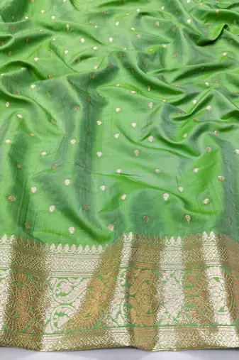 Green zari woven silk blend saree with blouse piece