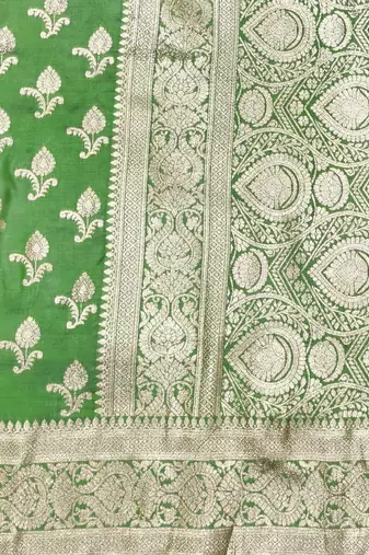 Green zari woven silk blend saree with blouse piece