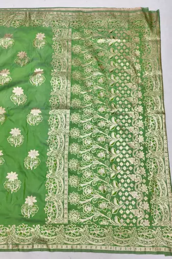 Green zari woven silk blend saree with blouse piece