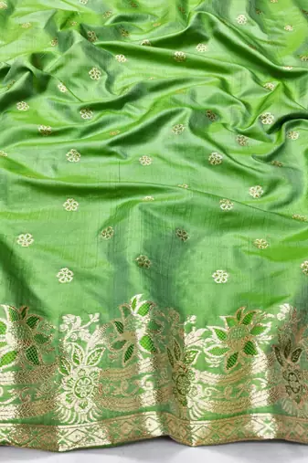 Green zari woven silk blend saree with blouse piece