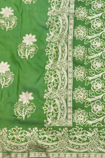 Green zari woven silk blend saree with blouse piece