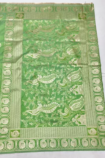 Green zari woven silk blend saree with blouse piece