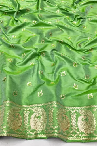 Green zari woven silk blend saree with blouse piece