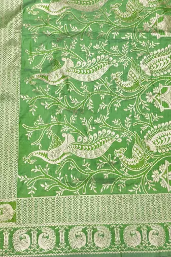 Green zari woven silk blend saree with blouse piece