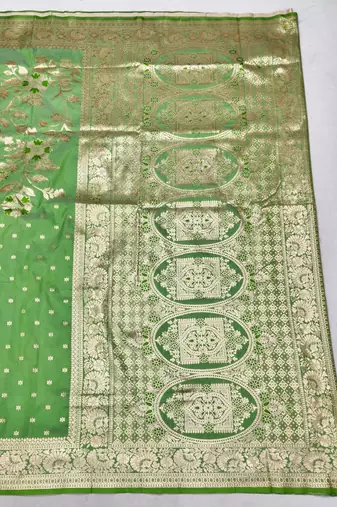 Light green zari woven silk blend saree with blouse piece