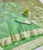 Light green zari woven banarasi silk blend saree with blouse piece