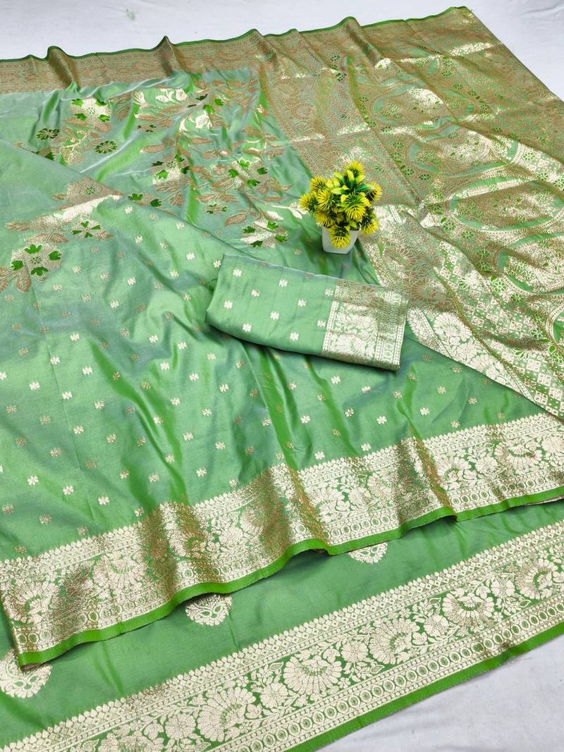 Light green zari woven banarasi silk blend saree with blouse piece