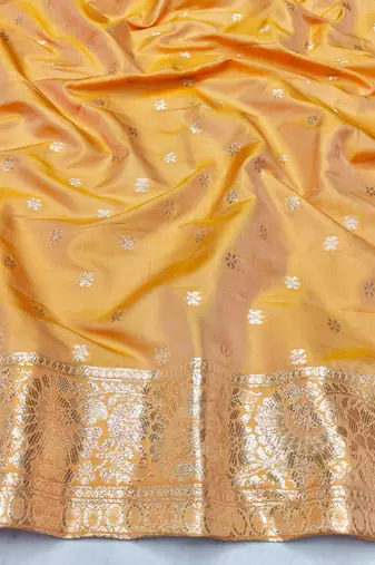 Light orange zari woven silk blend saree with blouse piece