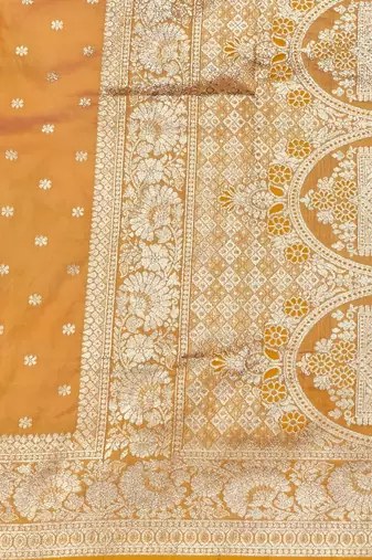 Light orange zari woven silk blend saree with blouse piece