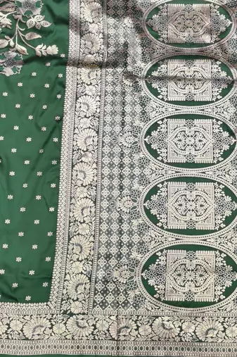 Dark green zari woven silk blend saree with blouse piece