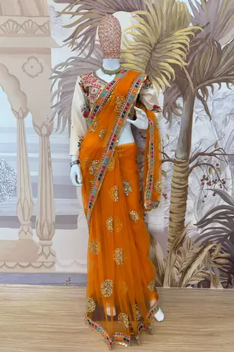 Yellow net embroidered saree with sequins work