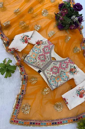 Yellow net embroidered saree with sequins work