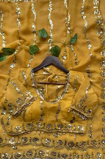 yellow silk blend embroidered saree with sequins work