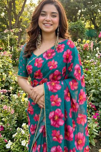 Teal georgette printed saree with floral print