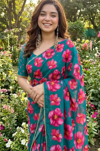 Teal georgette printed saree with floral print