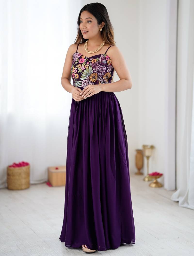Elegant wine georgette gown featuring multicolor floral embroidered bodice and flowing full-length flared design