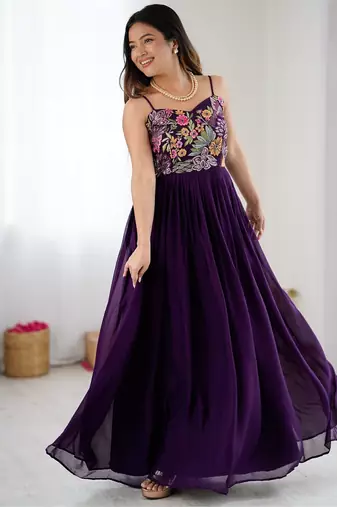 Elegant wine georgette gown featuring multicolor floral embroidered bodice and flowing full-length flared design