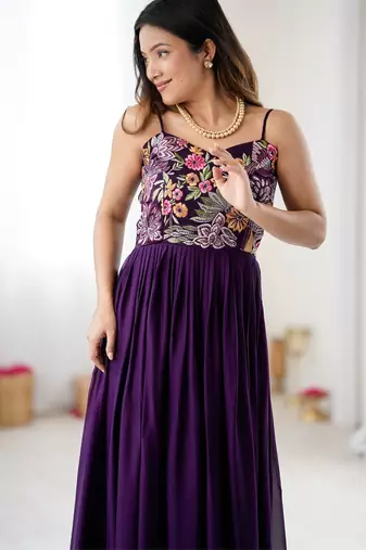 Elegant wine georgette gown featuring multicolor floral embroidered bodice and flowing full-length flared design