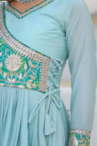 Sky blue color fancy gown in chinon with bandhani print and embroidery work