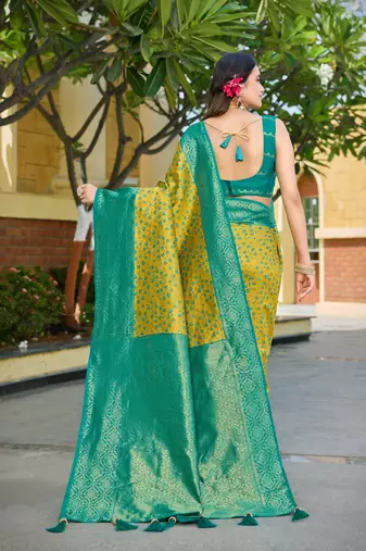 Banarasi satin silk saree floral zari woven saree with mustard color and turquoise blue border tassels