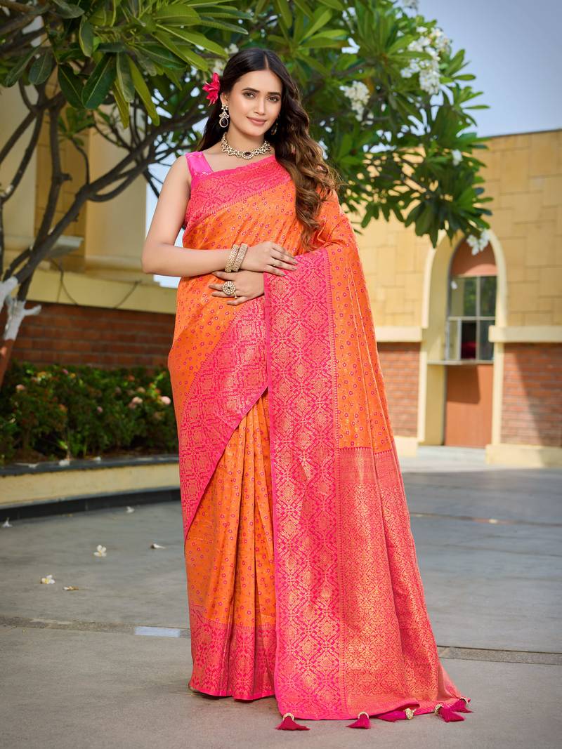 Banarasi satin silk blend saree floral zari woven saree with orange color and pink border & tassels