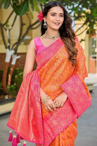Banarasi satin silk blend saree floral zari woven saree with orange color and pink border & tassels