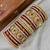 Premium red bridal chura with golden work