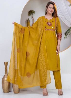 Beautiful three-piece salwar suit set in mustard yellow. 1