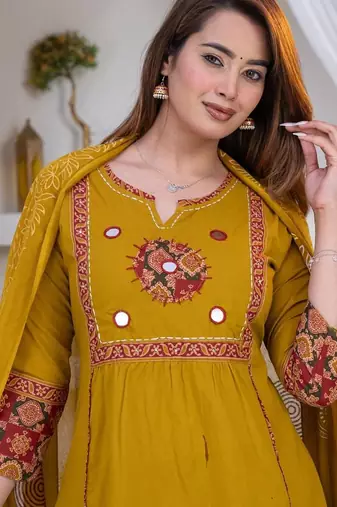 Beautiful three-piece salwar suit set in mustard yellow.