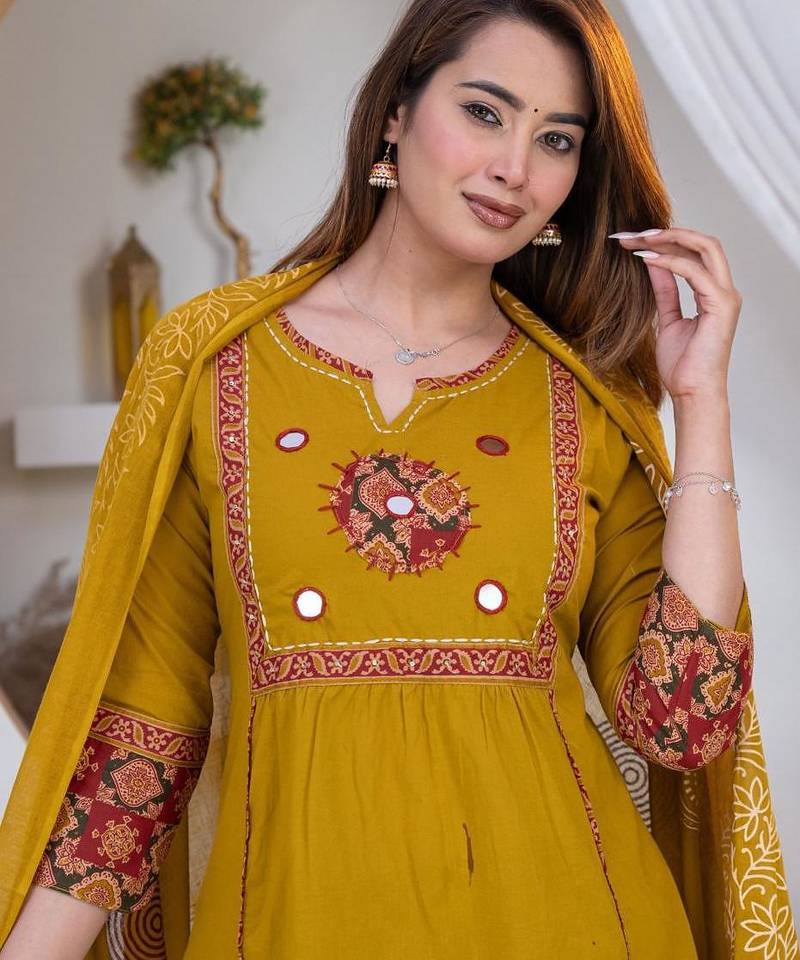 Beautiful three-piece salwar suit set in mustard yellow.