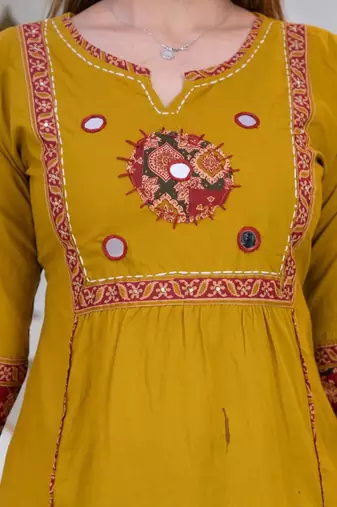 Beautiful three-piece salwar suit set in mustard yellow.