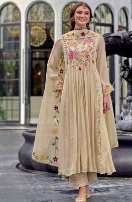 Beautiful  beige anarkali suit set featuring detailed floral thread work and embroidered dupatta. 1