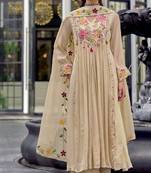 Beautiful  beige anarkali suit set featuring detailed floral thread work and embroidered dupatta.