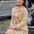 Beautiful  beige anarkali suit set featuring detailed floral thread work and embroidered dupatta.