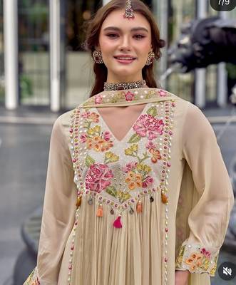 Beautiful  beige anarkali suit set featuring detailed floral thread work and embroidered dupatta. 3