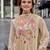 Beautiful  beige anarkali suit set featuring detailed floral thread work and embroidered dupatta.